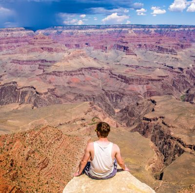 Why should you go for road trips by traveling in a car at least once?